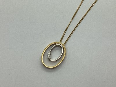 Lot 134 - A Modern 9ct Gold Bi-Colour 'Floating' Pendant,...