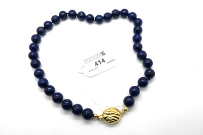 Lot 414 - A Lapis Lazuli Polished Bead Necklace, of...