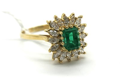 Lot 267 - An Emerald and Diamond Cluster Ring,...