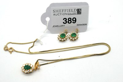 Lot 389 - A Pair of 18ct Gold Emerald Set Cluster...