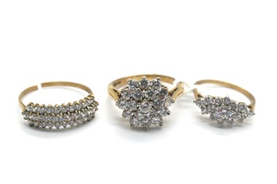 Lot 270 - A 9ct Gold CZ Cluster Dress Ring, claw set...