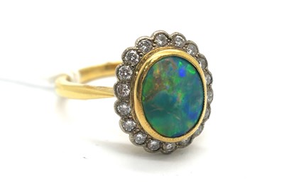 Lot 271 - An Opal and Diamond Cluster Ring, oval...