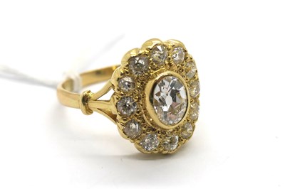 Lot 306 - An Antique Style Diamond Cluster Ring, oval...