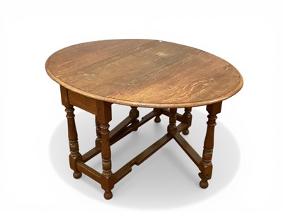 Lot 1577 - Oak Oval Topped Drop Leaf Table with gateleg...
