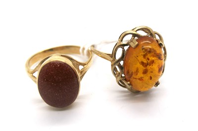 Lot 283 - A 9ct Gold Amber Set Dress Ring, oval claw set...