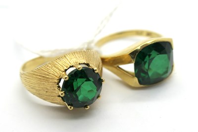 Lot 287 - Two Single Stone Dress Rings, stamped "750"...