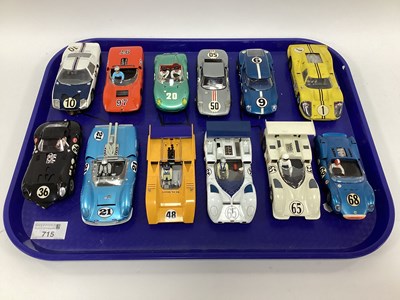 Lot 715 - Twelve 1:32 scale slot cars. Mostly with a Le...