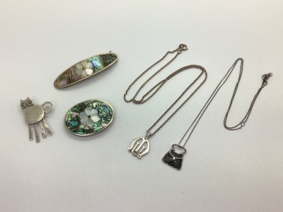 Lot 175 - An Illusion Set Blue Diamond Handbag Pendant,...