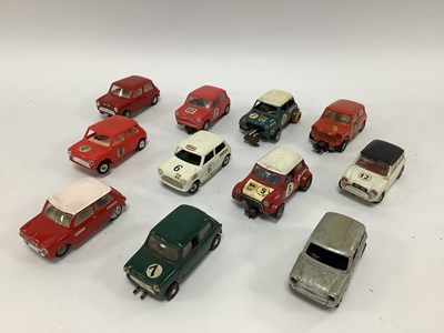 Lot 580 - Eleven 1:32 scale slot cars. All Minis. Many...