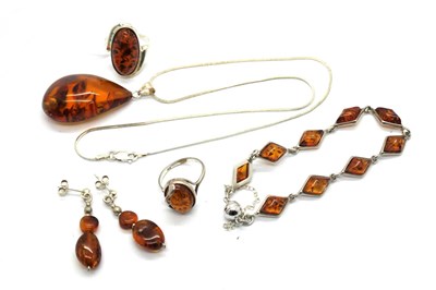Lot 441 - Modern Amber Set Dress Rings, together with an...