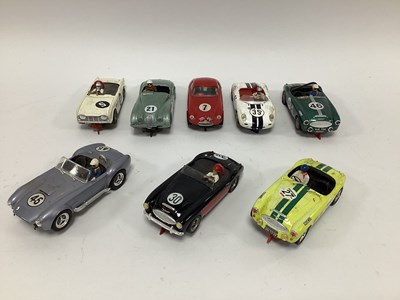 Lot 719 - Eight 1:32 scale slot cars. All open top...