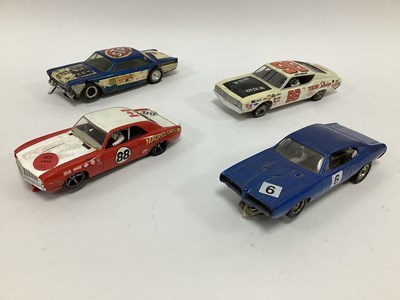 Lot 714 - Four 1:32 scale slot cars. All with a American...