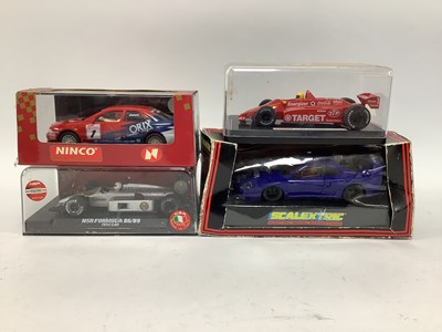 Lot 595 - Four Model Slot Cars by Hornby, NSR, Ninco and...