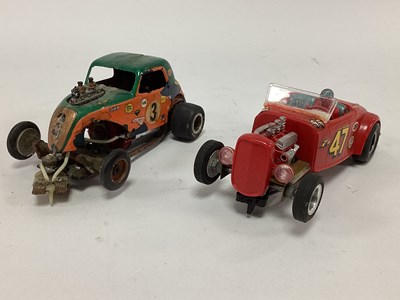 Lot 864 - Two 1:32 scale slot cars. Both with a stock...