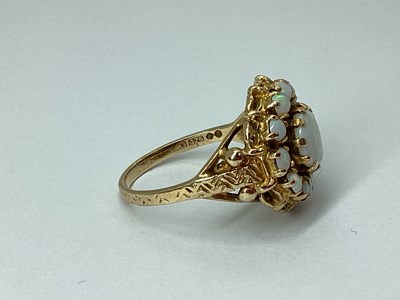 Lot 95 - A 9ct Gold Oval Cluster Ring, claw set...