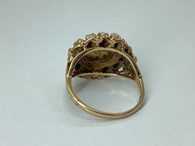 Lot 95 - A 9ct Gold Oval Cluster Ring, claw set...