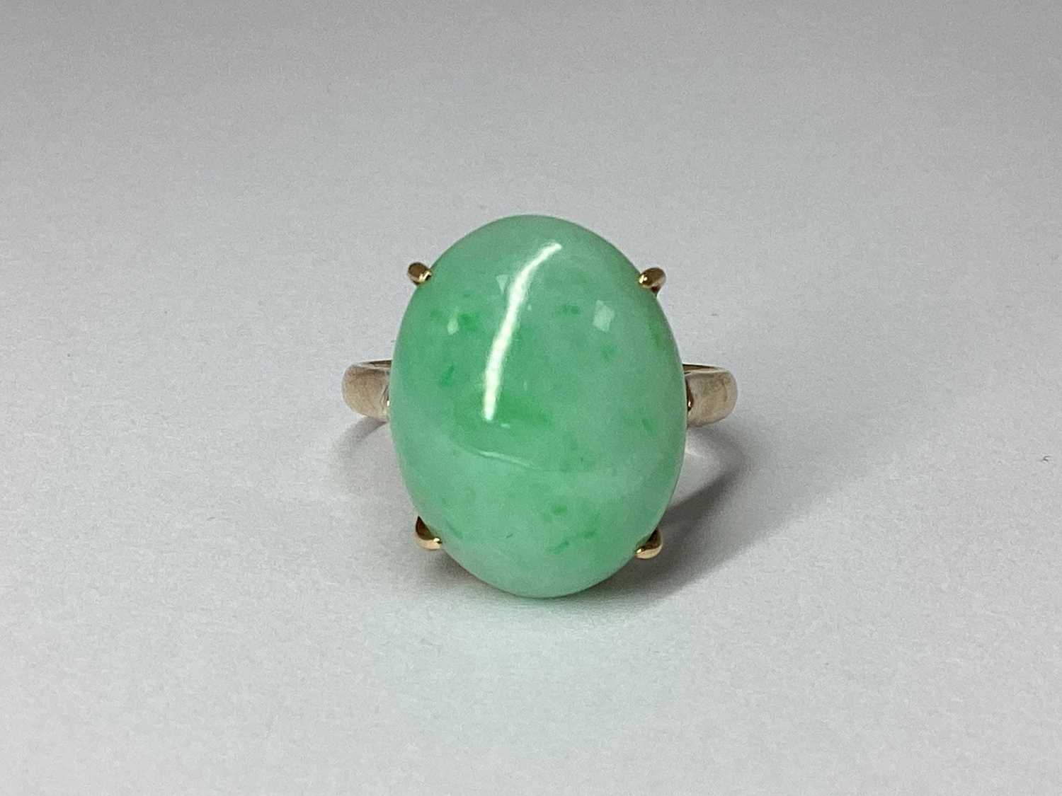 Lot 94 - A Single Stone Oval Cabochon Ring, four claw...