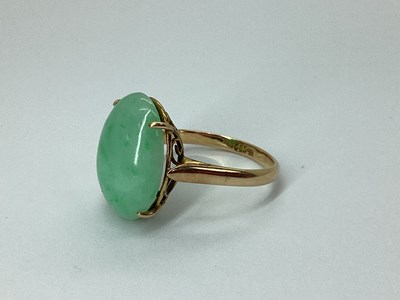 Lot 94 - A Single Stone Oval Cabochon Ring, four claw...