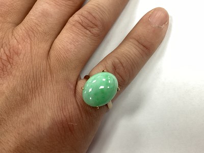 Lot 94 - A Single Stone Oval Cabochon Ring, four claw...