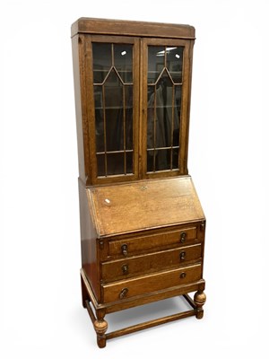 Lot 1565 - 1930s Oak Bureau Bookcase with astragal doors...