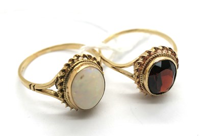 Lot 303 - A 9ct Gold Opal Single Stone Dress Ring, oval...
