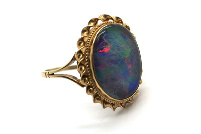 Lot 289 - A 9ct Gold Oval Black Opal Dress Ring,...