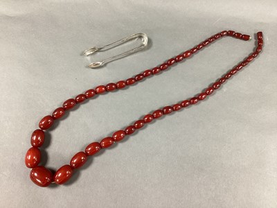 Lot 186 - A Long Single Strand Cherry Amber Colour...