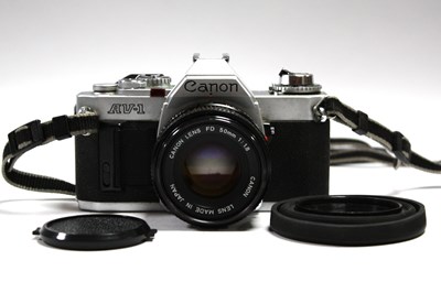 Lot 834 - Canon AV-1 35mm Film Camera No.484559 with...