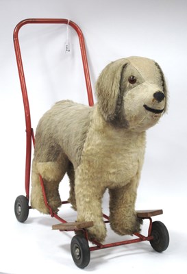 Lot 1454 - A Mid 1900s Wheeled Childs Ride On Plush Dog.