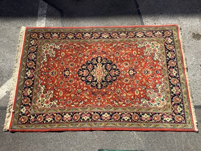 Lot 1562 - Wool Tasseled Persian Rug, with allover floral...