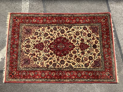 Lot 1551 - Wool Tasseled Persian Rug, tightly knotted,...