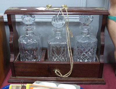 Lot 1361 - Tantalus, mahogany effect, holding three...