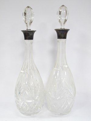 Lot 1180 - A Pair of Cut Glass Decanters with sterling...