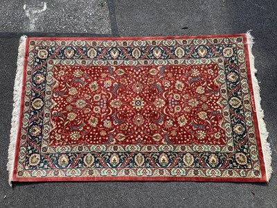 Lot 1553 - Silk Tasseled Rug, with allover floral...