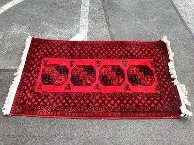 Lot 1596 - Woolo Tassled Rug, with four octagonal motifs...