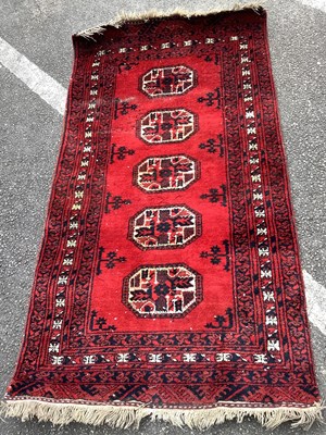 Lot 1513 - Middle Eastern Wool Tasseled Rug, with five...
