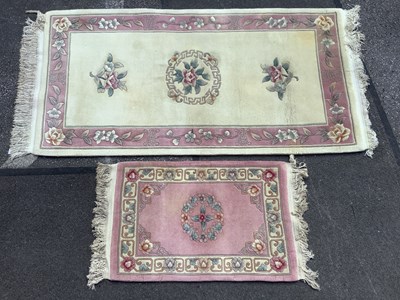 Lot 1629 - Two Chinese Wool Tassled Rugs, cream ground...