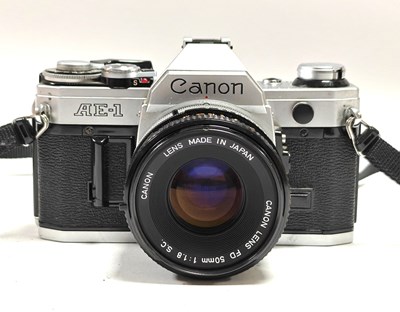 Lot 821 - Canon AE-1 35mm SLR Film Camera with attached...
