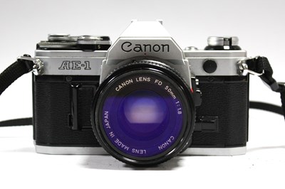 Lot 820 - Canon AE-1 35mm SLR Film Camera with attached...