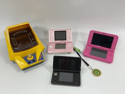 Lot 705 - Three Nintendo DS handheld gaming consoles...