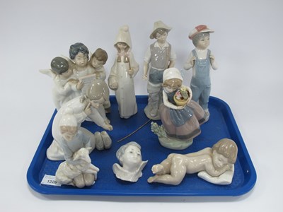 Lot 1228 - Nine Spanish Lladro porcelain figures,...