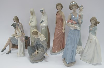 Lot 1179 - Nine Spanish Lladro NAO porcelain lady figures,...