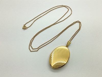 Lot 107 - A Textured Oval Locket, stamped "9. 375",...