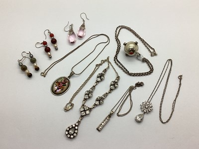 Lot 135 - An Ornate Harmony Ball Pendant, cabochon set...