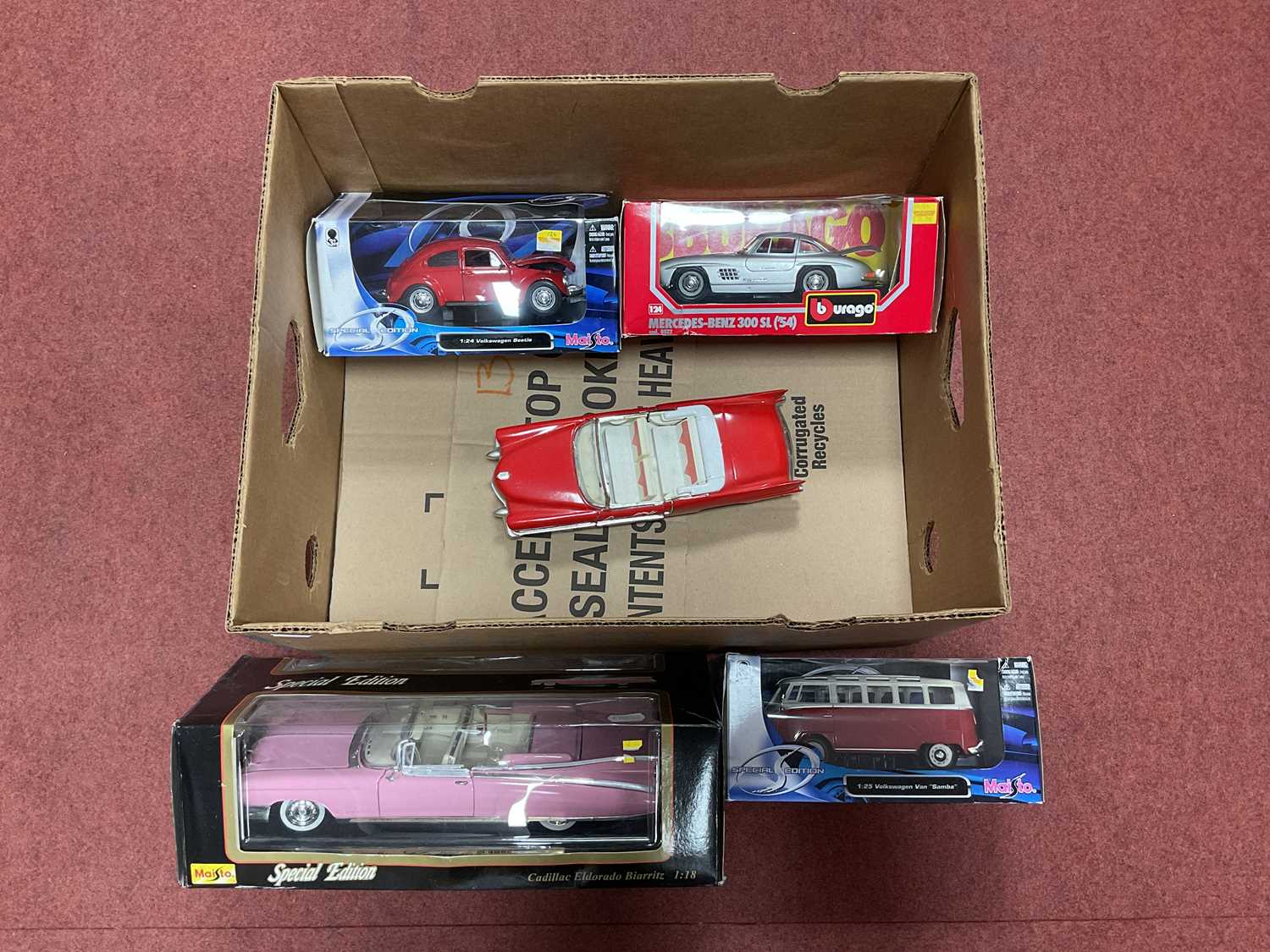Lot 321 - Four boxed 1:18/1:24/1:25 diecast model...