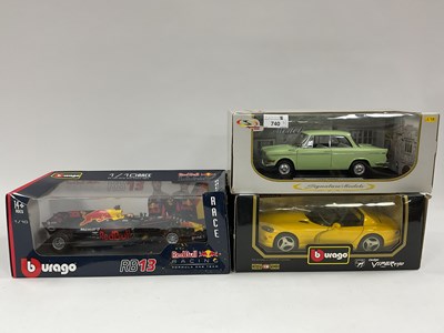 Lot 740 - Three 1:18 scale diecast model cars comprising...