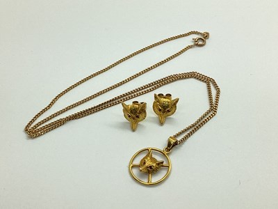 Lot 98 - A Circular Fox Head Pendant, of openwork...