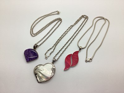 Lot 133 - A Modern Polished Hardstone Pendant, cabochon...