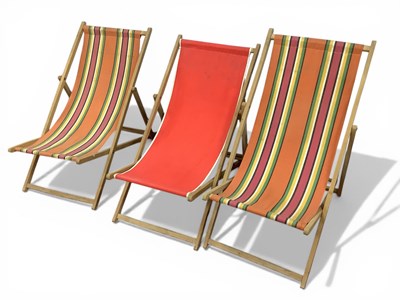 Lot 1146 - Three Folding Deck Chairs, two in striped...