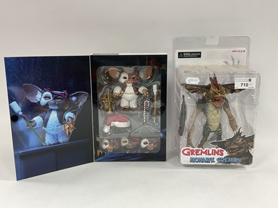 Lot 710 - Two Neca Reel Toys Gremlins plastic figure...